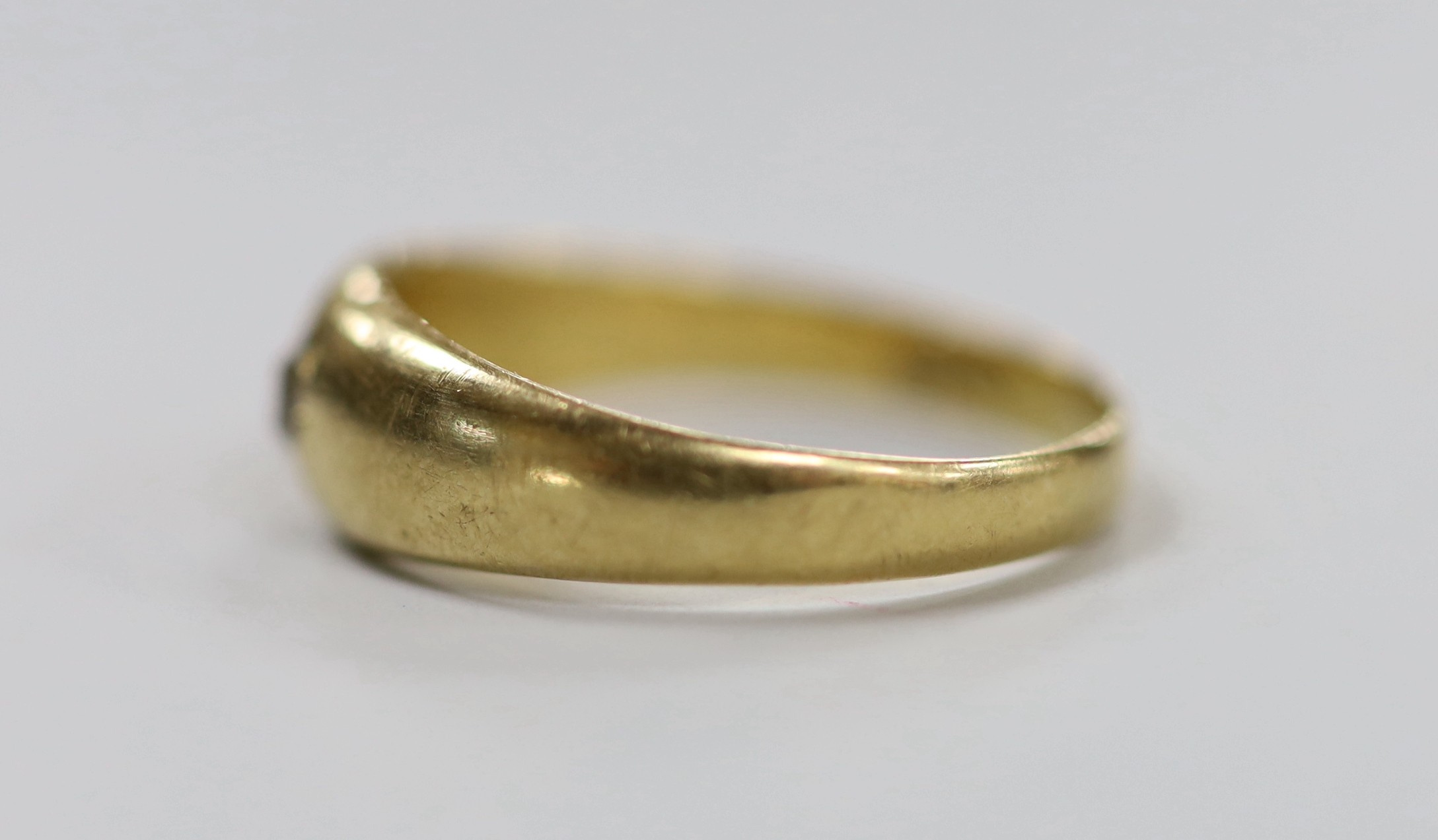 An 18ct gold and gypsy set solitaire diamond ring, size O/P, gross weight 3.9 grams.